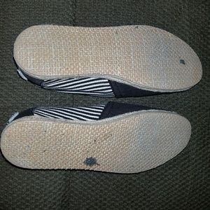 TOM'S Black and Beige canvas slip on's